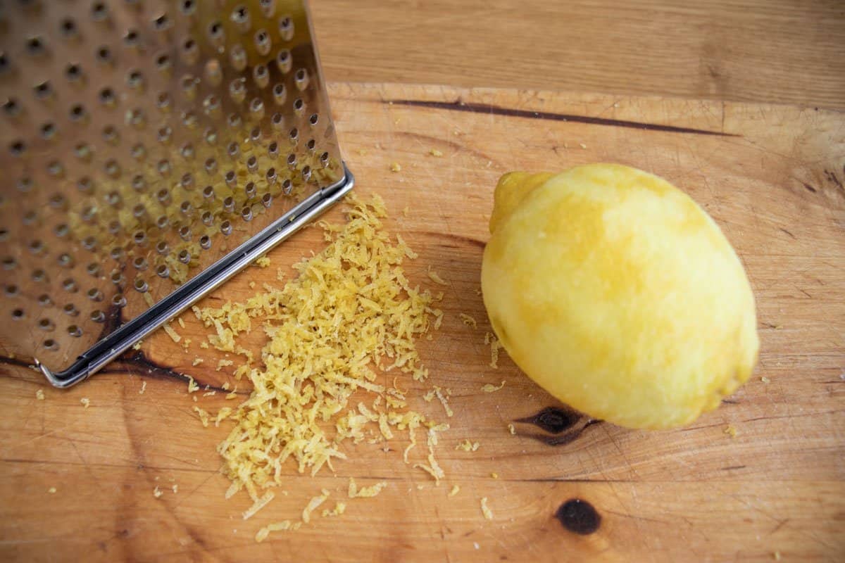 Grater with lemon and grated zest