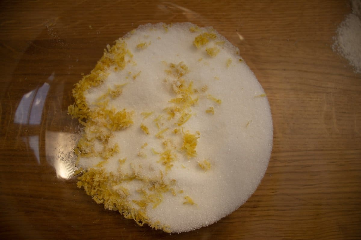Sugar and lemon zest in bowl