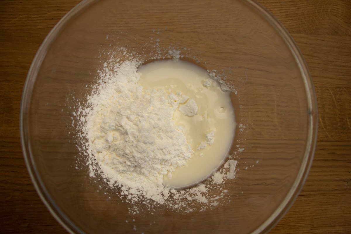 Cornflour (cornstarch) with a little milk in a glass mixing bowl