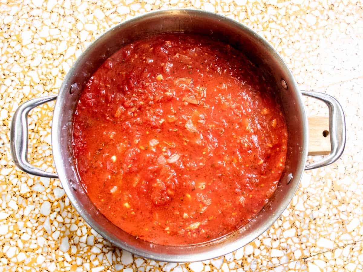 Tomato mixture in a saucepan viewed from above